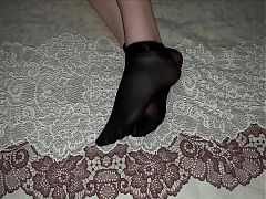 Girl in Black Nylon Socks Caresses Her Legs